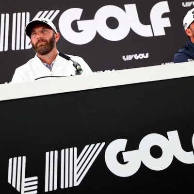 Dustin Johnson Graeme McDowell Photo by ADRIAN DENNIS / AFP