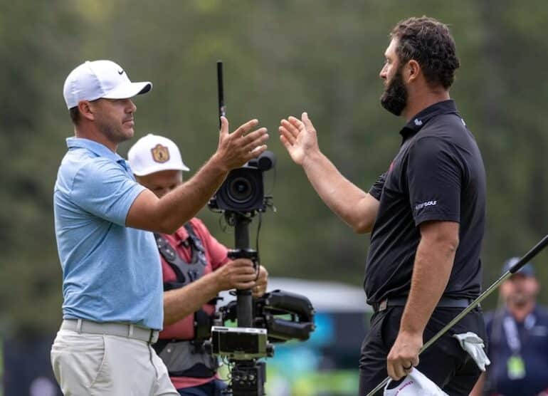 Captain Jon Rahm of Legion XIII shakes hands with Captain Brooks Koepka Photo by Chris Trotman/LIV Golf