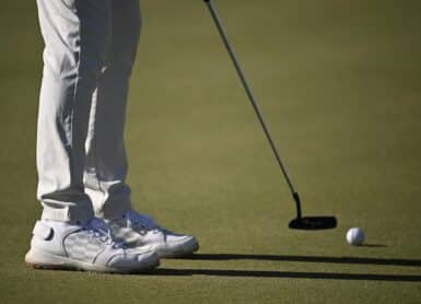 Adam Svensson putt putting Photo by Orlando Ramirez/Getty Images